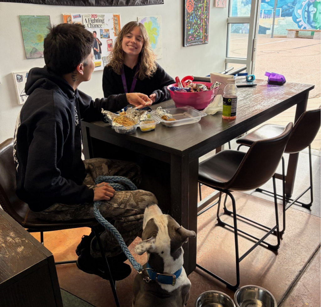 Outreach Case Manager Kayla and a client talking at The PLACE's drop-in center.